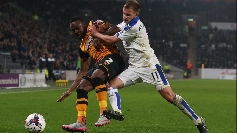 Moses Odubajo of Hull is challenged by Leicester's Marc Albrighton