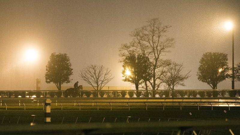 Morning work takes place at a gloomy Keeneland this morning