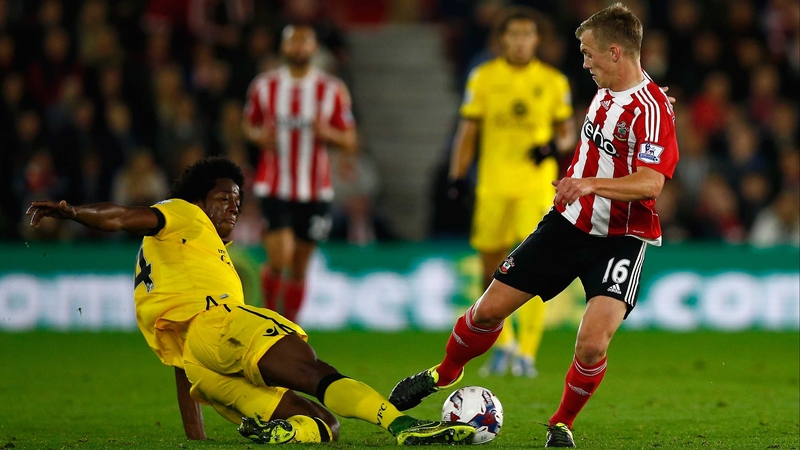 Carlos Sanchez of Aston Villa wins the ball from Southampton's James Ward-Prowse