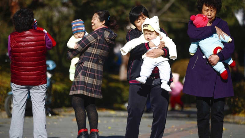 Parents and babies gather at a park in Beijing, China