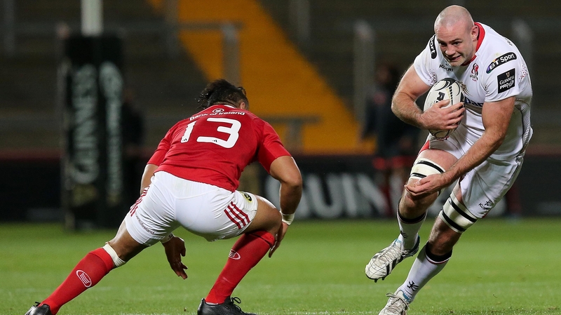 Munster's Francis Saili gets ready to put in another bit on tackle Ulster's Lewis Stevenson