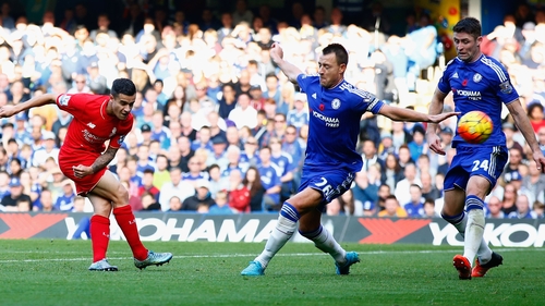 Philippe Coutinho drills home Liverpool's second at the Bridge
