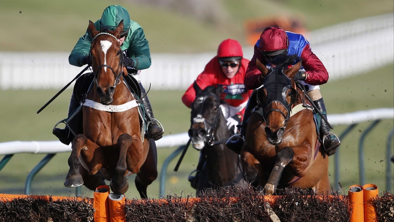 Barry Geraghty riding Peace And Co (L) to victory in The JCB Triumph Hurdle Trial at Cheltenham