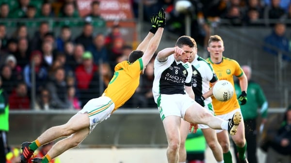 Legion's Shaun Keane gets a shot away despite the efforts of South Kerry's Padraig O’Sullivan
