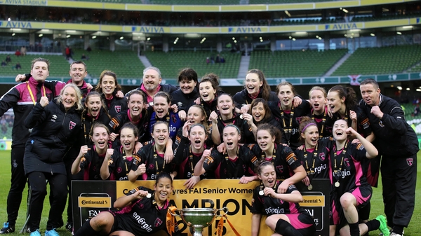 The players and staff of Wexford Youths Women celebrate their dramatic victory