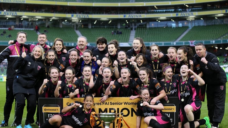 The players and staff of Wexford Youths Women celebrate their dramatic victory