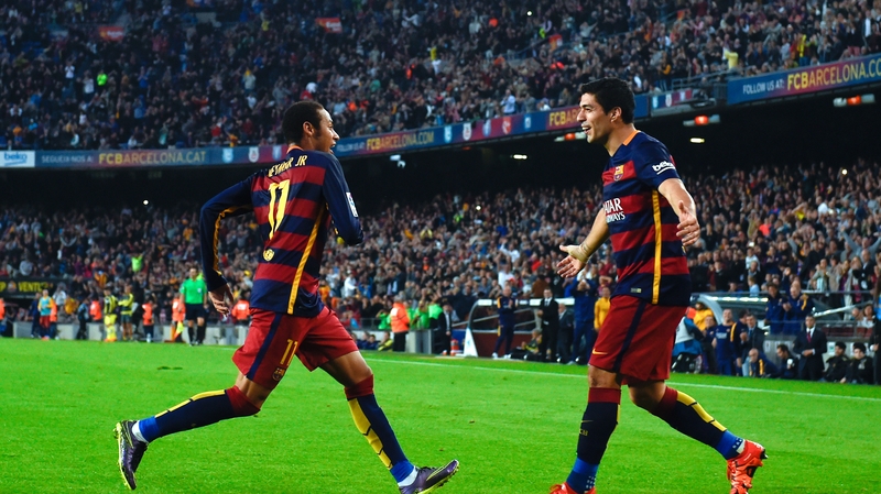 Neymar of FC Barcelona celebrates with team-mate Luis Suarez