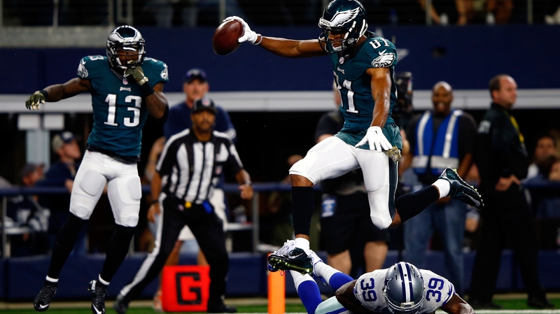 Wide receiver Jordan Matthews #81 of the Philadelphia Eagles leaps over cornerback Brandon Carr #39 of the Dallas Cowboys to score the game-winning touchdown