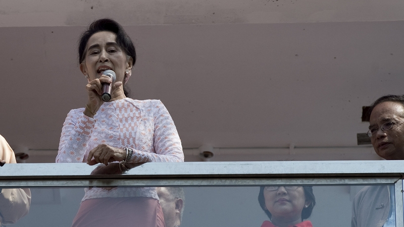 Aung San Suu Kyi delivers a speech from the balcony of the NLD headquarters in Yangon