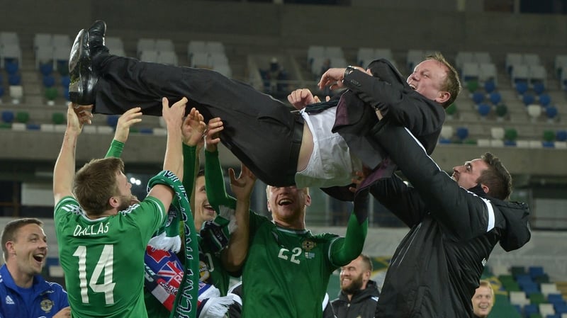 Northern Ireland players showing their appreciation for Michael O'Neill after securing Euro 2016 qualification