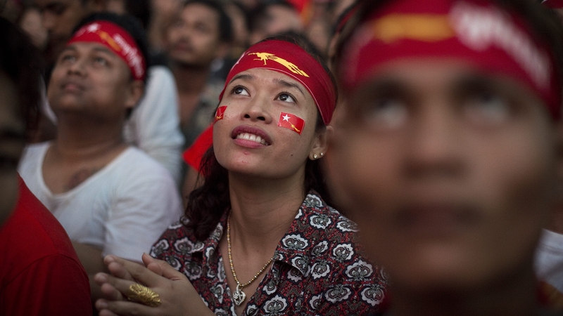 Supporters of Aung San Suu Kyi watch the results come in