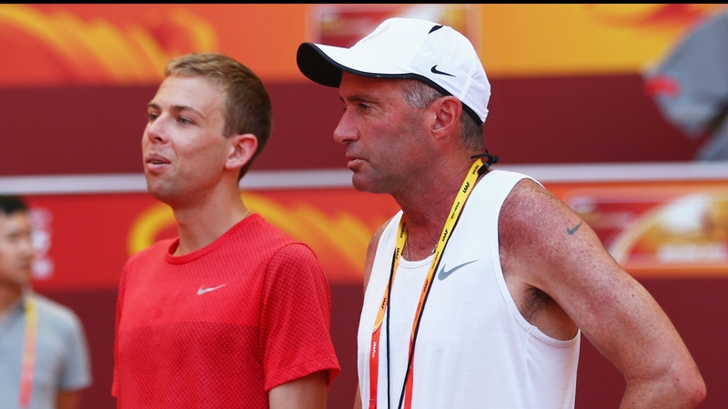 Galen Rupp of the United States (L) and coach Alberto Salazar