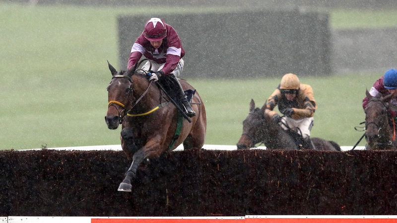 Bryan Cooper on Road To Riches jump the last to win the Clonmel feature