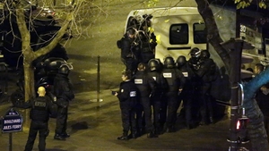 Police secure the area close to the Cafe Bonne Biere