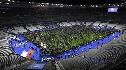 Fans poured on to the pitch at the Stade de France during the attacks in Paris last November