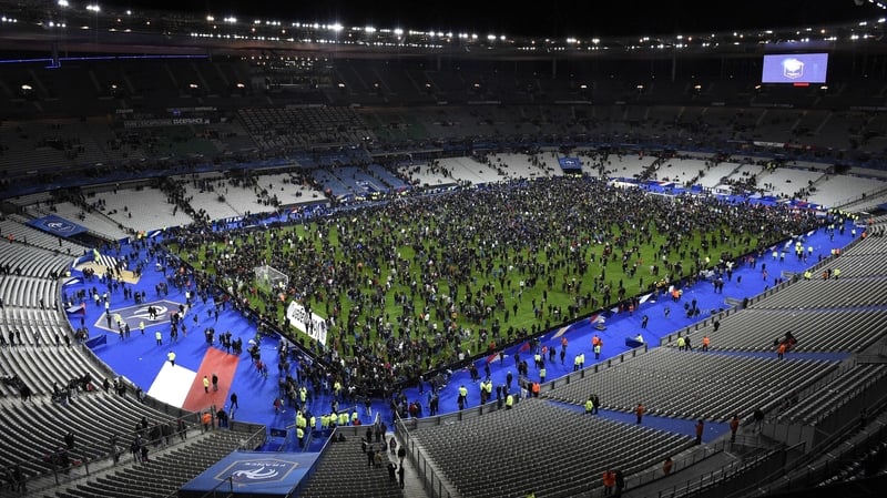 Fans poured on to the pitch at the Stade de France during the attacks in Paris last November