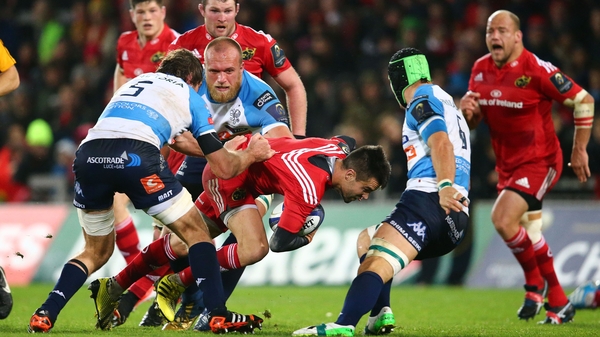 Munster's Conor Murray is tackled by Jean-Francois Montauriol, Rudolph Duncan Naude and Francesco Minto of Benetton Treviso