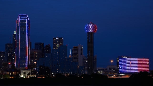 The Dallas skyline turns blue, white and red