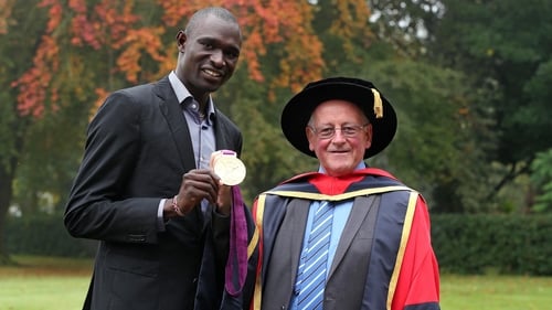 Brother Colm O'Connell with 800m world record holder David Rudisha in 2012 when he received an Honorary Doctorate from DCU
