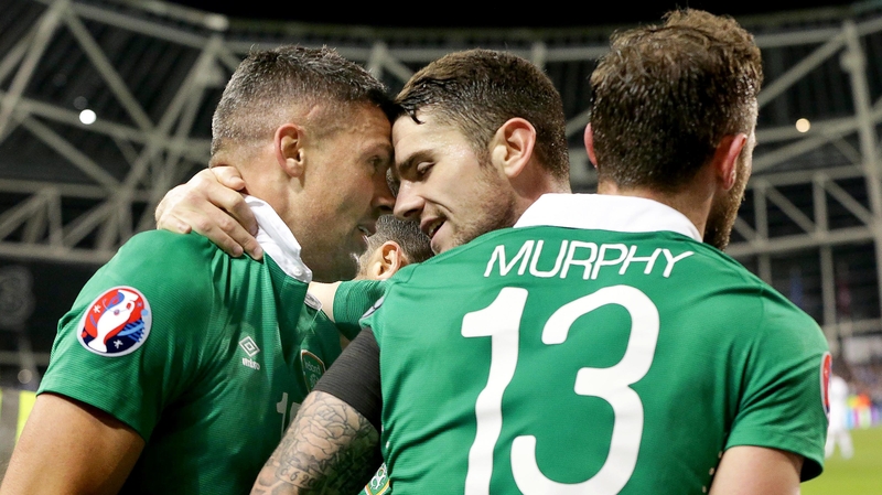 Robbie Brady celebrates with two-goal hero Jon Walters