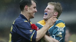 Warren Tredrea says hello to Anthony Lynch in 2002