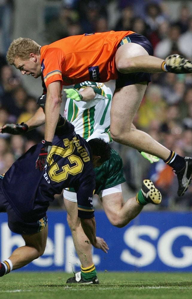 Dustin Fletcher and Andrew McLeod of Australia colide in 2005