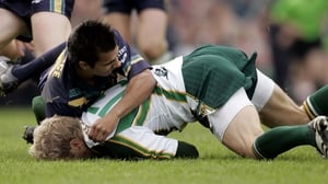 Graham Geraghty is driven to the ground by Danyle Pearce, a tackle which led to the Meath man being carried off in 2006