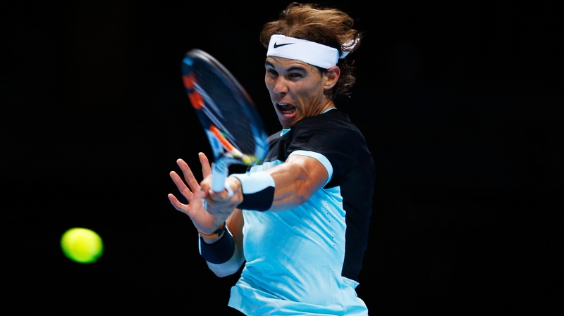 Rafael Nadal hits a forehand against David Ferrer