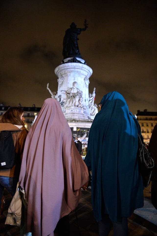 People make a chain on republic square in Paris