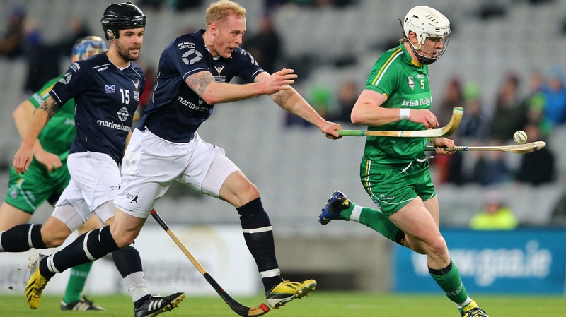 Ireland's Damien Healy is tackled by Conor Cormack of Scotland