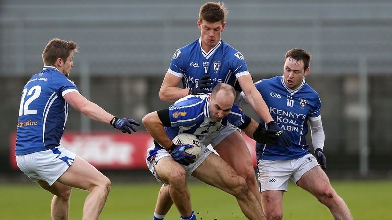 St Loman's John Heslin and, David Windsor and Kieran Lynam tackle Stephen Hiney of Ballyboden St Enda's