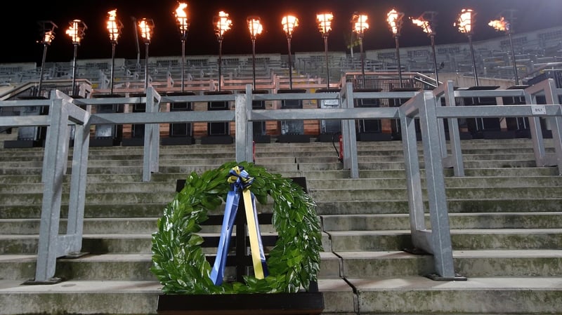 A wreath lies in front of 14 torches on Hill 16 to remember the 95th anniversary of Bloody Sunday