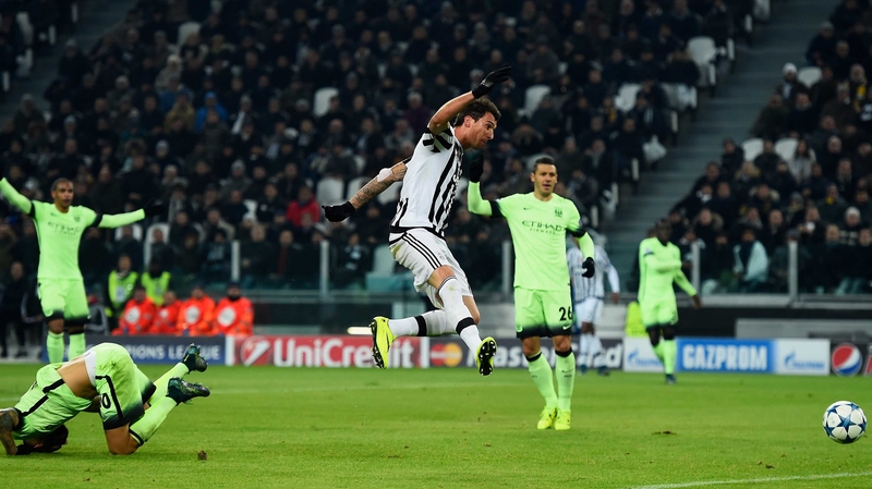 Mario Mandzukic of Juventus scores the game's only goal