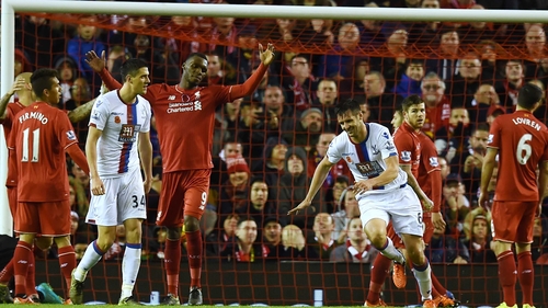 Scott Dann wheels away in celebration after scoring in Crystal Palace's 2-1 win at Anfield