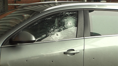 The bullet-proof glass and reinforced panelling on the PSNI car protected the two officers sitting inside