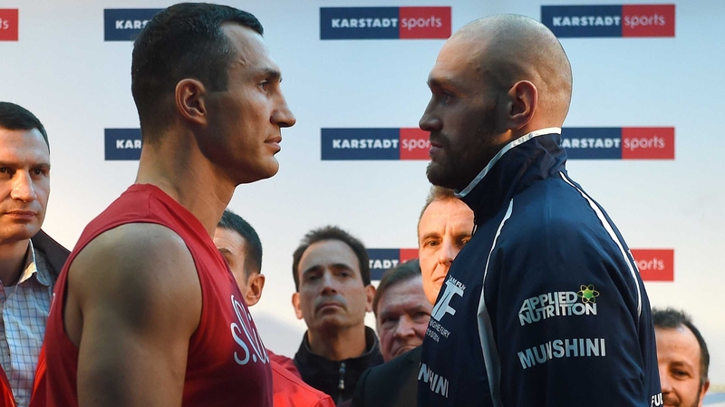 Wladimir Klitschko (L) and Tyson Fury at the weigh-in in Essen, Germany