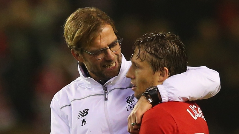 Jurgen Klopp (L) with long-serving midfielder Lucas Leiva