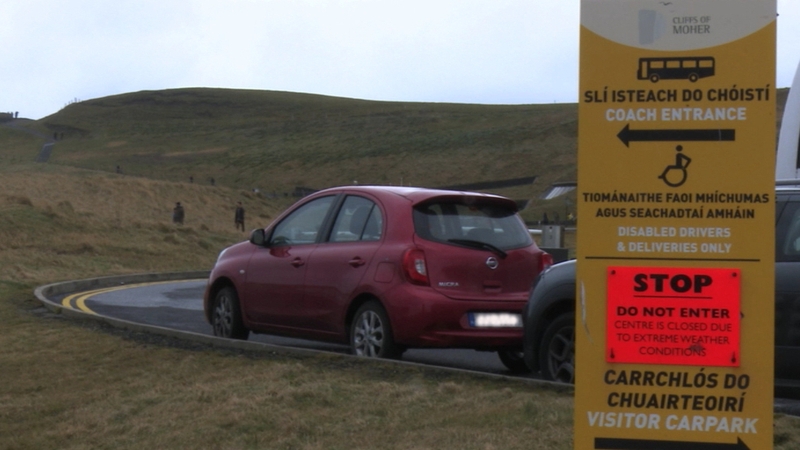 Walkers ignore advice to stay away from the Cliffs of Moher in Co Clare