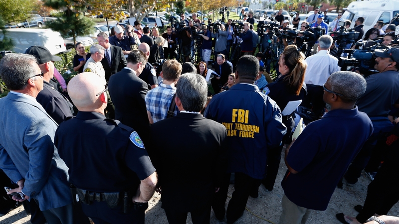 San Bernardino Police Chief Jarrod Burguan speaks to the media