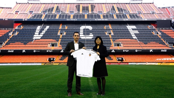 Gary Neville meets the press on the pitch of The Mestella alongside Valencia chairwoman Lay Hoon Chan