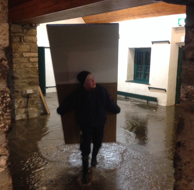 Shane Egan (13) helping to move furniture from Thoor Ballylee as the flood comes in (Pic: Colm Farrell)