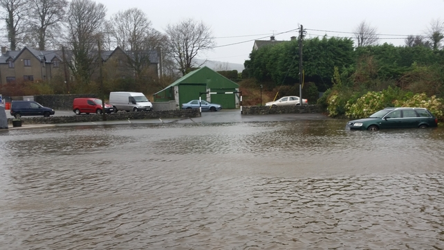 Cars caught up in the flood waters in Kenmare