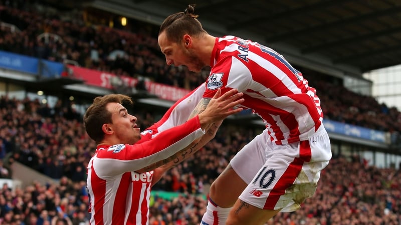 Marko Arnautovic (R) of Stoke City celebrates scoring his team's first goal with his team mate Xherdan Shaqiri