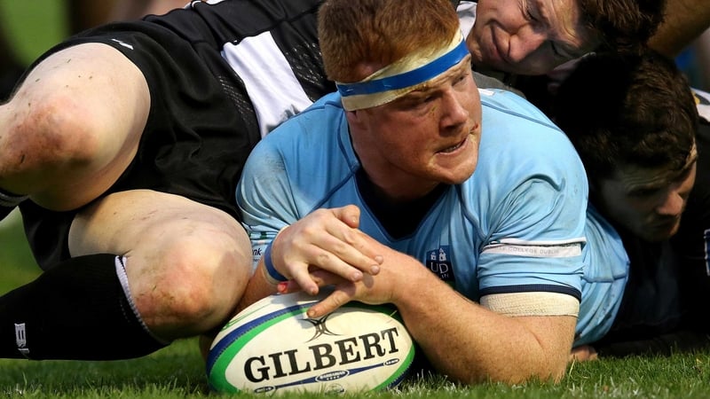 Peadar Timmins squirms over for UCD against Old Belvedere