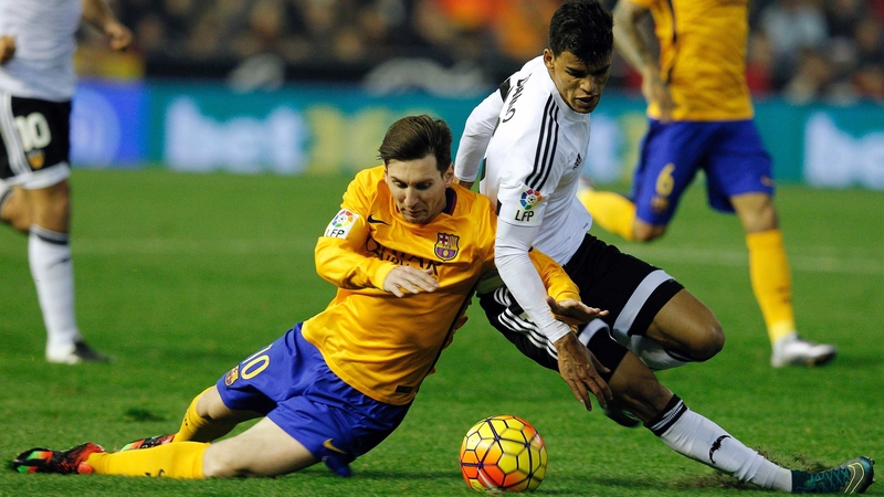 Lionel Messi comes under pressure from Valencia's Salvadorean midfielder Danilo Barbosa