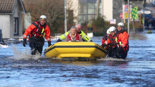 A woman is evacuated in Craughwell, Co Galway (Pic: Hany Marzouk)