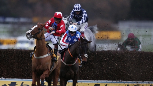 Jamie Moore riding Sire De Grugy (L) survived a stewards enquiry to win the Sandown feature