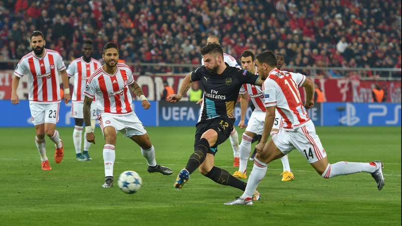 Olivier Giroud scores the second in his hat-trick against Olympiacos