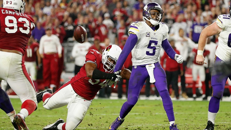Dwight Freeney knocks the ball free from quarterback Teddy Bridgewater of the Minnesota Vikings