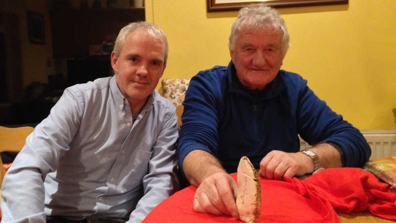 Vincent O'Brien and Noel McDonagh, Waterford History Group, with the flint axe